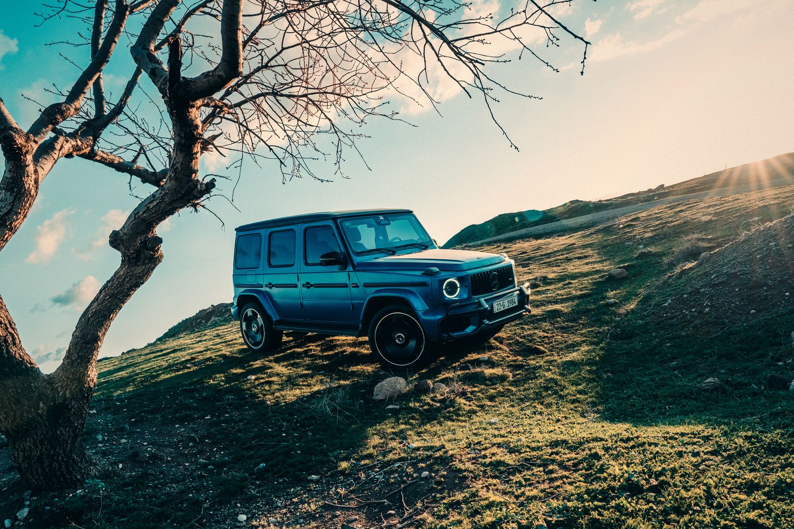 Black Mercedes-Benz G-Class, a body-on-frame SUV, on a bridge